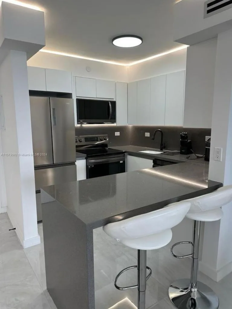 Full kitchen with stainless steel appliances