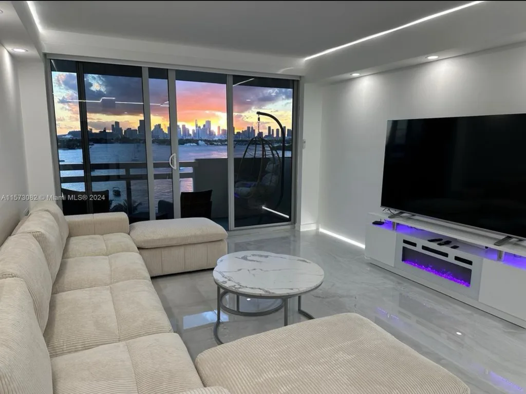 Living room at golden hour with panoramic bay views